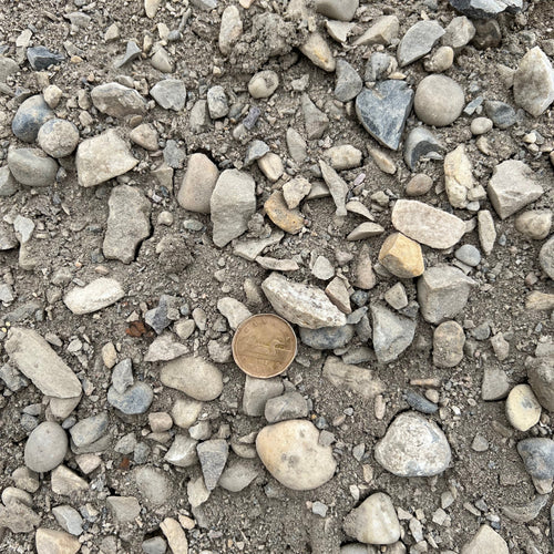 25mm Road Crush Calgary – 25mm road crush gravel with a blend of crushed rock and fines for pathways, driveways, parking pads, shed bases, and compacted landscape base applications. Bulk loose delivery available throughout Calgary and surrounding areas. Order online.