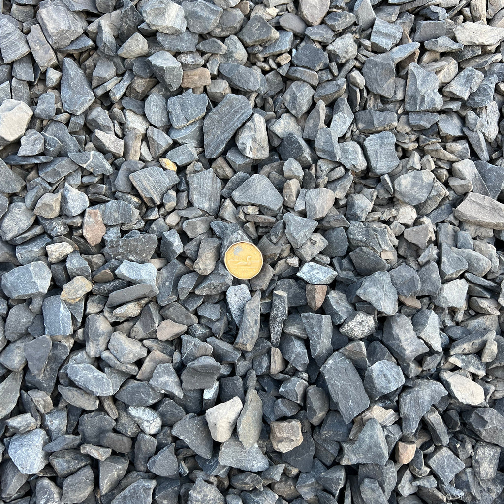 25mm Rundle Rock Calgary – Premium 25mm Rundle Rock with natural charcoal and grey tones for decorative landscaping, garden beds, tree rings, pathways, drainage areas, landscape borders, and low-maintenance outdoor spaces. Bulk loose delivery available throughout Calgary and surrounding areas. Order online.