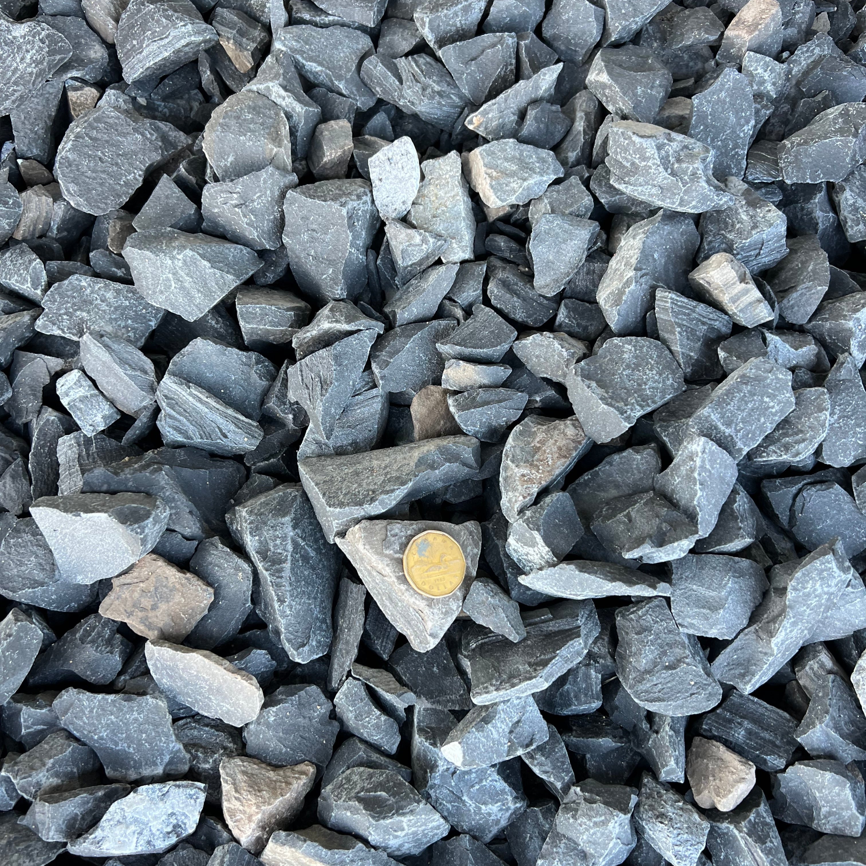 40mm Rundle Rock Calgary – Premium 40mm Rundle Rock with natural charcoal and grey tones for decorative landscaping, garden beds, tree rings, drainage areas, dry creek beds, landscape borders, and low-maintenance outdoor spaces. Bulk loose delivery available throughout Calgary and surrounding areas. Order online.